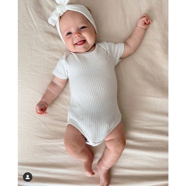 Organic bodysuit short sleeve- ribbed cotton onesie for baby and other Purchase Wholesale size 7 diapers. Free Returns & Net 60 Terms on Faire trending on Faire.