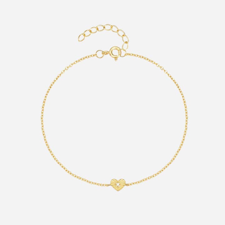 Bracciale con ciondolo a cuore al centro in cristallo, in oro. per la vendita all'ingrosso da parte di White Leaf