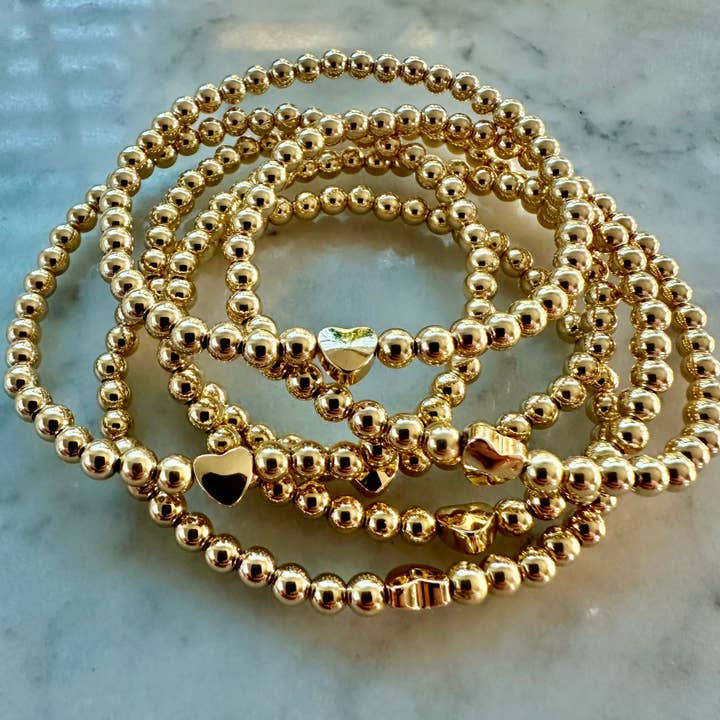 4mm pärlstav armband prydd med en hjärta pärla för wholesale av Kelly and Rose Boutique