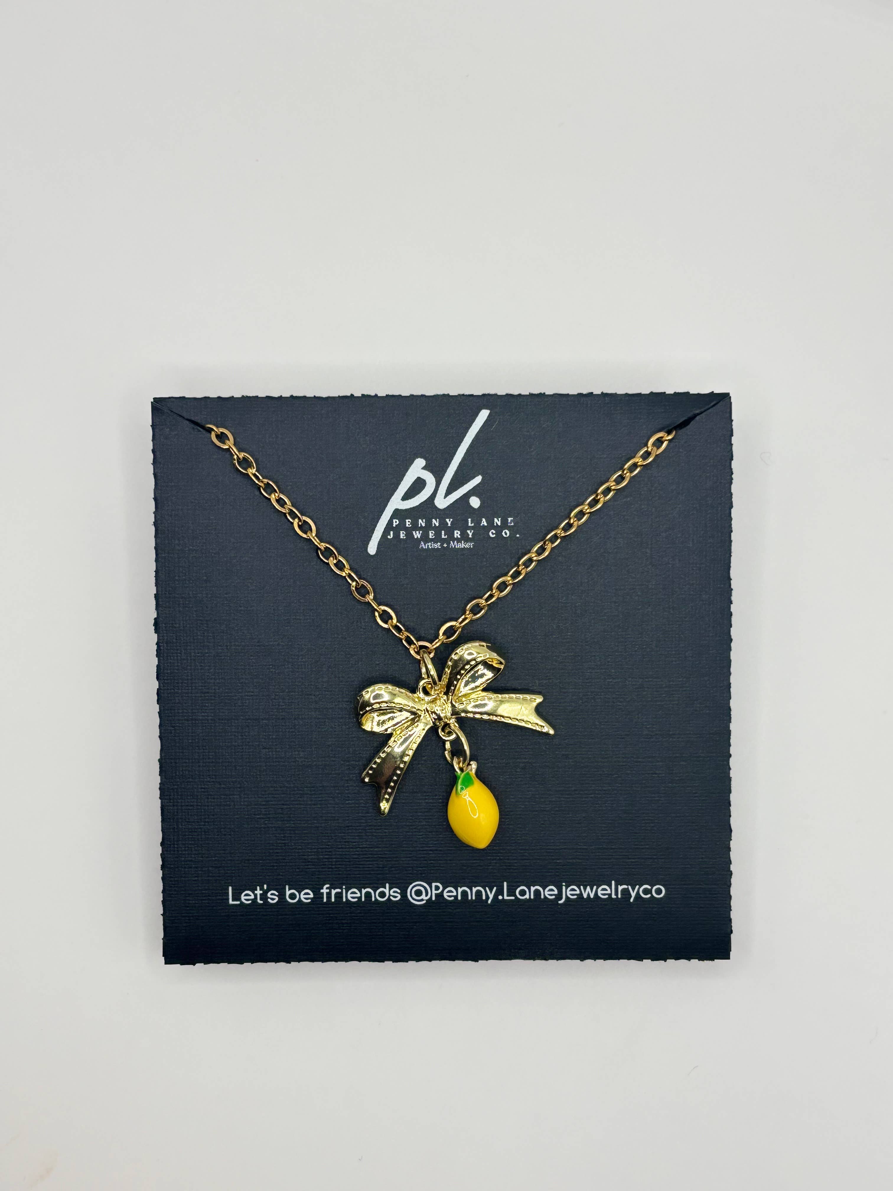Penny Lane Jewelry Co - Wholesale Pendant/Charm Necklace - Daphne Gold Lemon Bow charm necklace