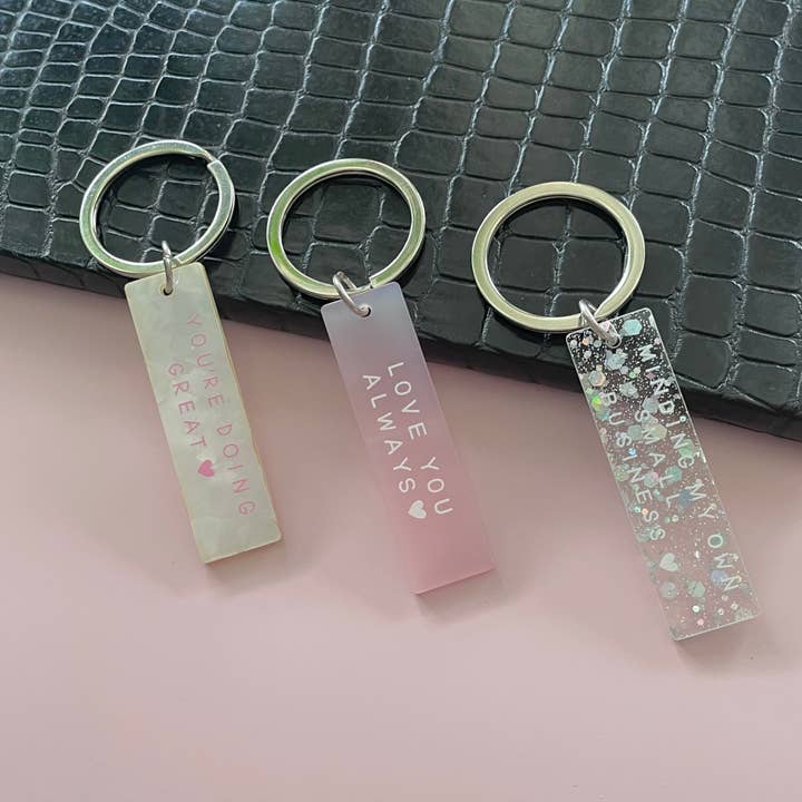 Minding My Own Small Business Holographic Glitter Keyring for wholesale by Dolly’s Doodles