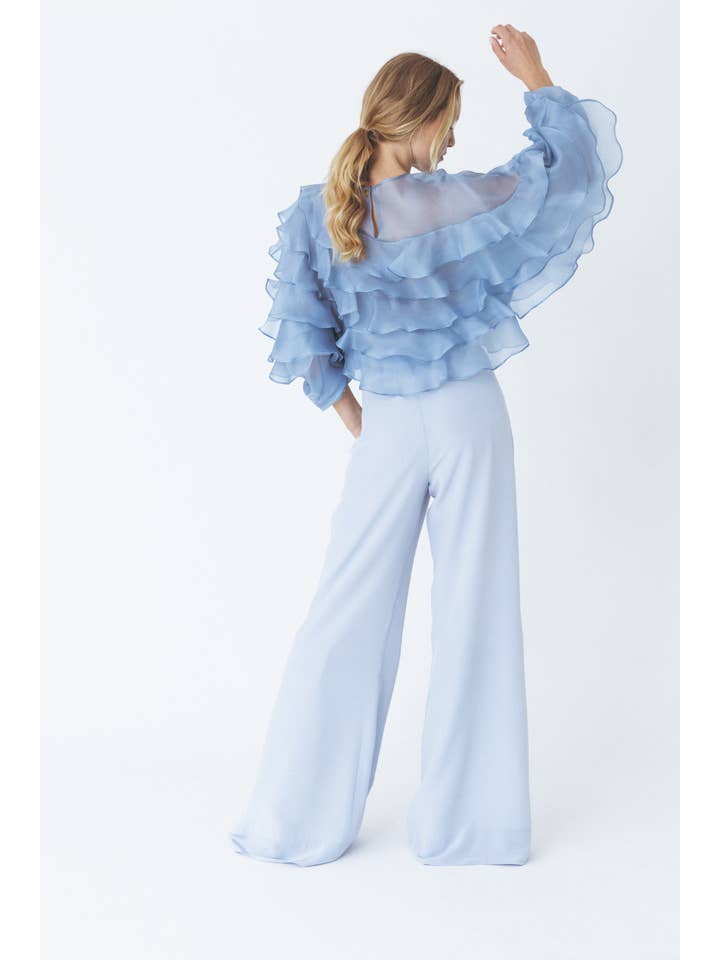 Blu Blusa blu voluminoso con volant in vendita all'ingrosso su Faire4