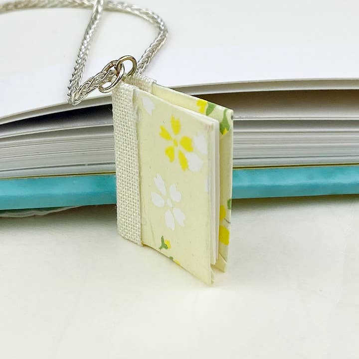 White and Yellow Cherry Blossoms on Yellow Book Pendant- s1 for wholesale by Nicolette Tallmadge Designs