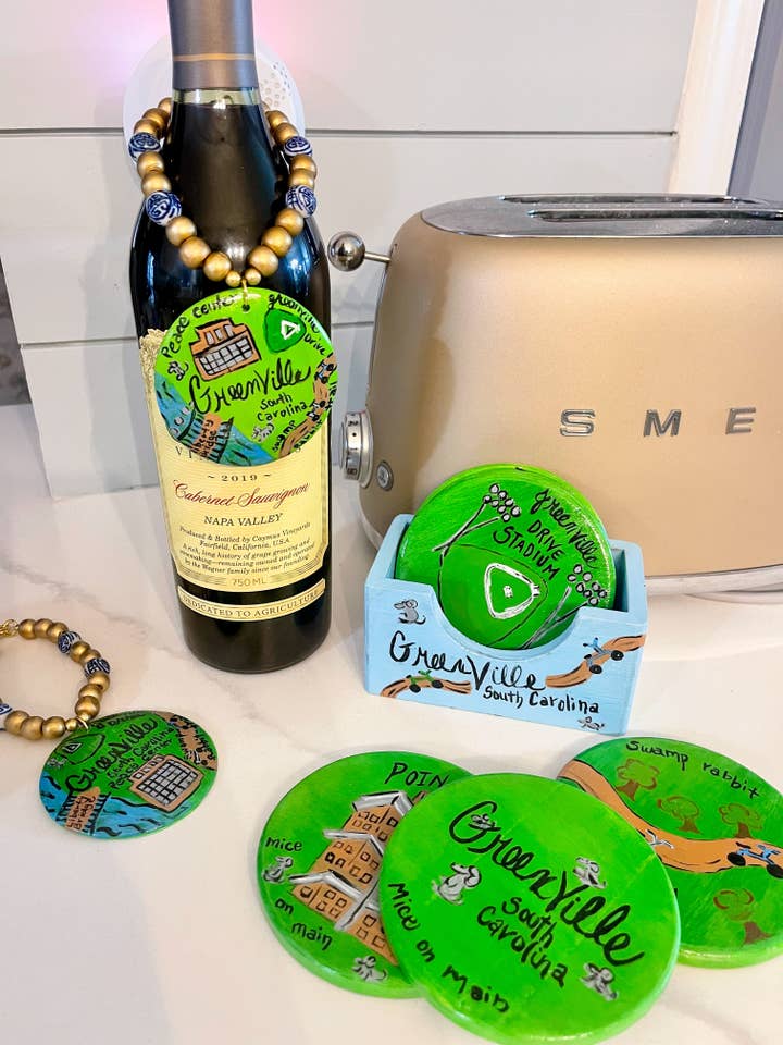 greenville, sc scenic coasters/ millie bling tag for wholesale by millie b & co