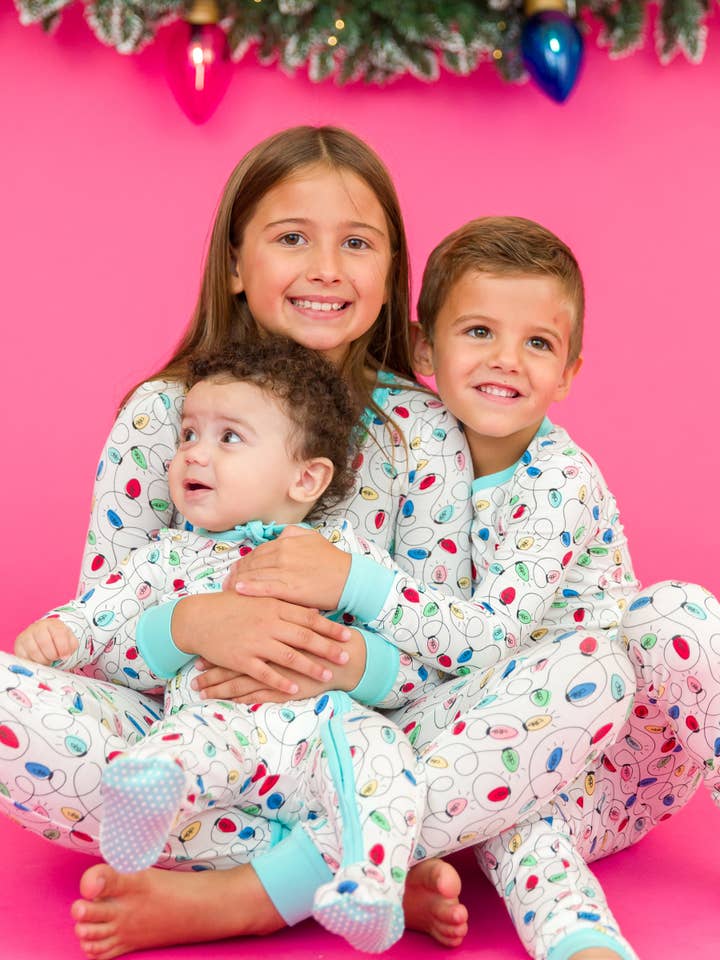 Off White Girls Holiday Lights Bamboo Viscose Ruffle Long Sleeve Pajama Set
for wholesale on Faire