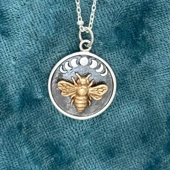 Bronze Bee on Silver Disk With Moon Phases necklace for wholesale by Elizabeth Jewelry