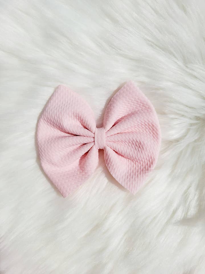 Nœud rose bébé pour la vente par East Coast Kids