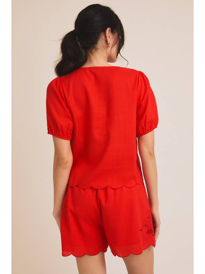 Red EYELET EMBROIDERD FRONT TIES TOP AND SCALLOP SHORTS for wholesale on Faire