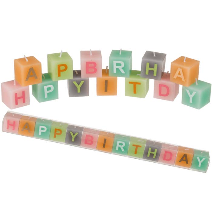 Pastel coloured square candles with letters, for wholesale by Out of the blue KG