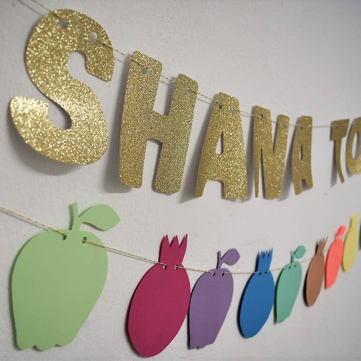 Ghirlanda multicolore Rosh Hashanah e stendardo glitterato dorato per la vendita all'ingrosso da parte di thekitcut
