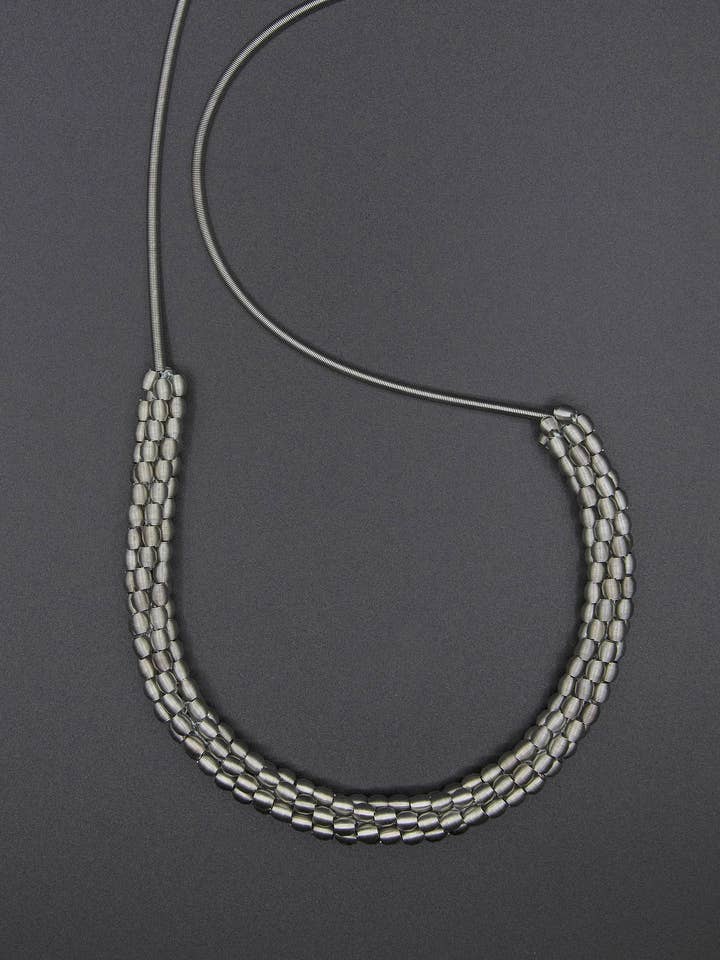 S87L - long silver piano wire necklace with woven silver bea for wholesale by Sea Lily