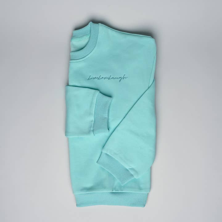 Felpa crop girocollo « livelovelaugh » verde menta per la vendita all'ingrosso da parte di ANSHIN