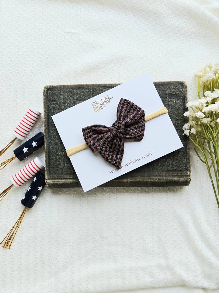 Small Pinwheel Bow on Headband • Patriotic Railroad Stripe for wholesale by Revival Bow Co.