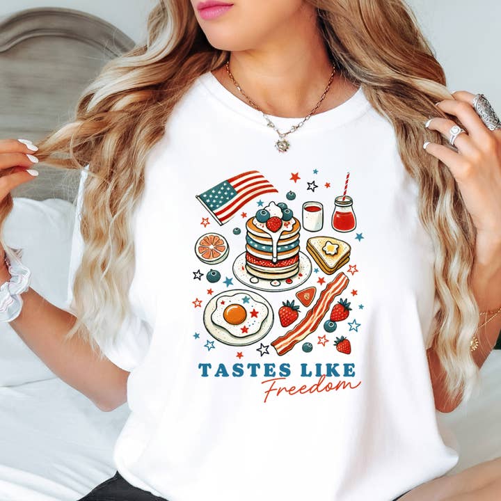 T-shirt illustré Tastes Like Freedom du 4 juillet pour la vente par Happy Mail Wholesale