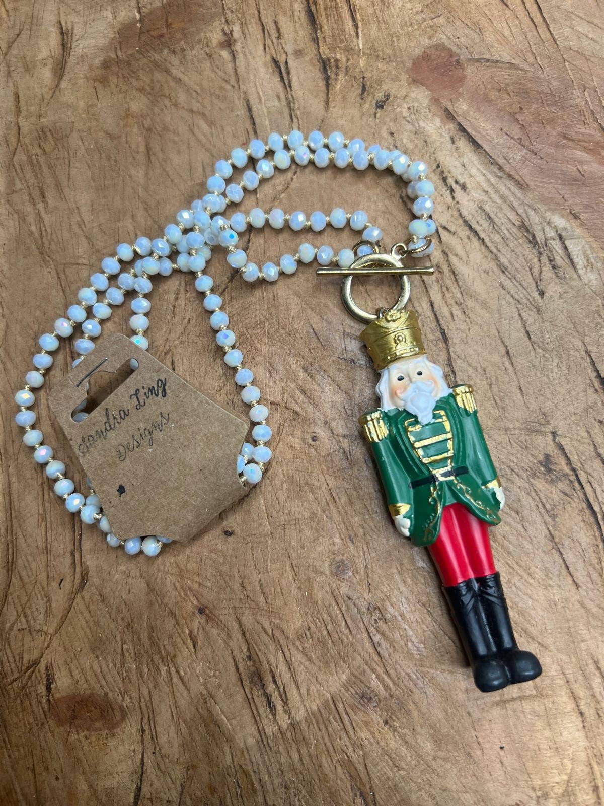 Sandra Ling Designs - Wholesale Pendant/Charm Necklace - 🪵 Nutcracker Charm Necklace – “Crack a Smile"