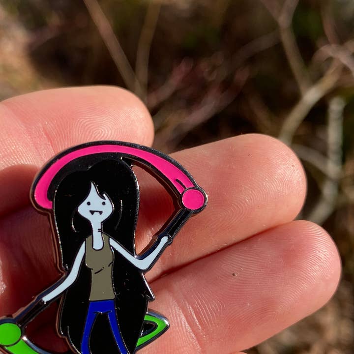 Marceline Spins Poi Pin – 1.5" Glow In The Dark Pin for wholesale by Mushroom Kingdom Pins