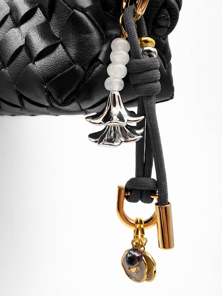 Leo Charm – Bag & Accessory Charm (Gray, Silver Plumeria) for wholesale by Leo & Lei