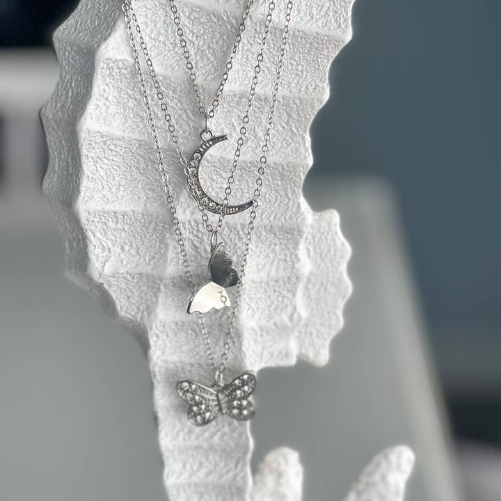 Harris Girls & Co. - Wholesale Pendant/Charm Necklace - "Butterfly In The Sky" Layered Necklace Silver