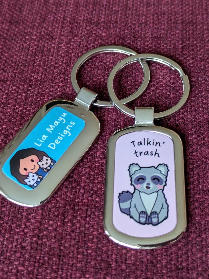 Talking trash raccoon pun metal keychain for wholesale by Lia Mayu Designs