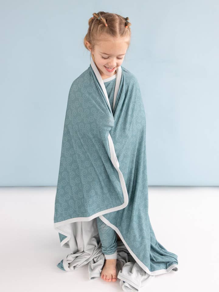 MANTA DE ENSUEÑO SLEEPY SMILES para venta al por mayor de Dream Big Little Co.