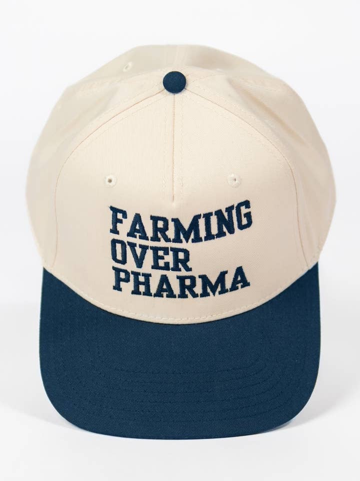 'Farming over Pharma' Navy Women's Embroidered Trucker Hat for wholesale by American Farm Company