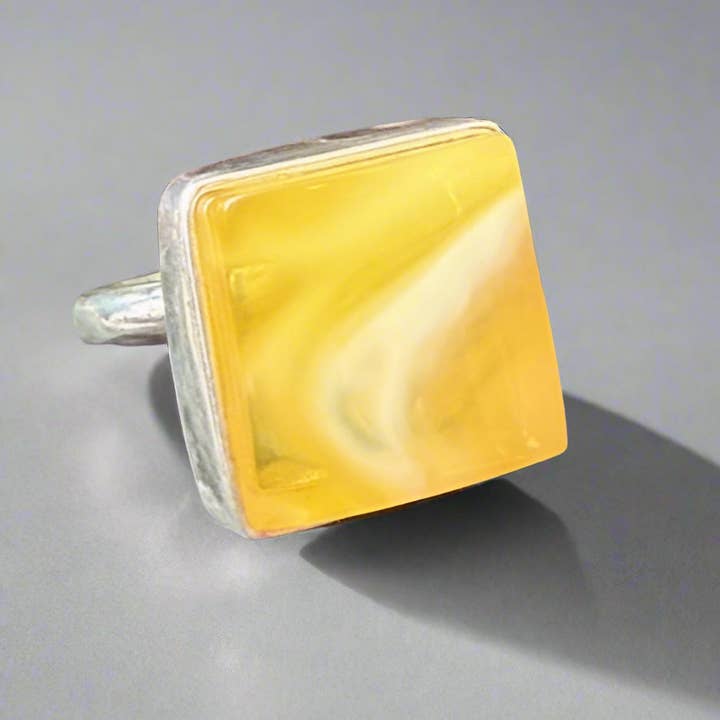 Square-cut yellow Baltic amber ring for wholesale by Amber House