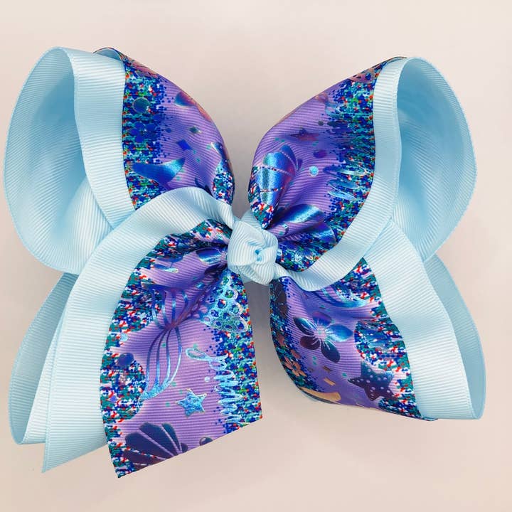 Blå Metallic Sjöjungfru Rosett för wholesale av Luminous Sky Bowtique