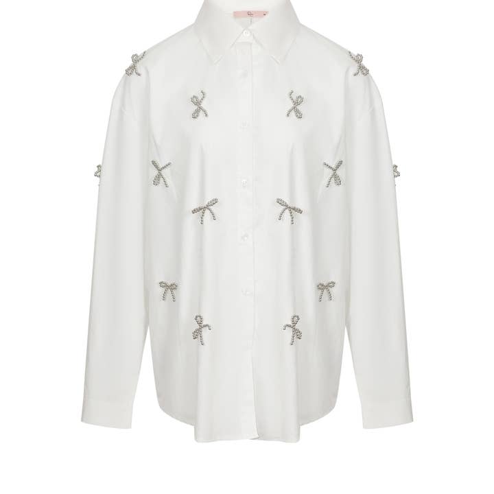 Bow Accent button Down Shirt and other Purchase Wholesale riviste straniere. Free Returns & Net 60 Terms on Faire trending on Faire.