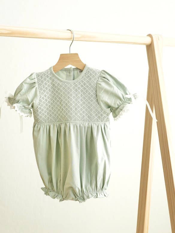 Sage hand-smocked lace girl bubble for wholesale by Mom & Co.