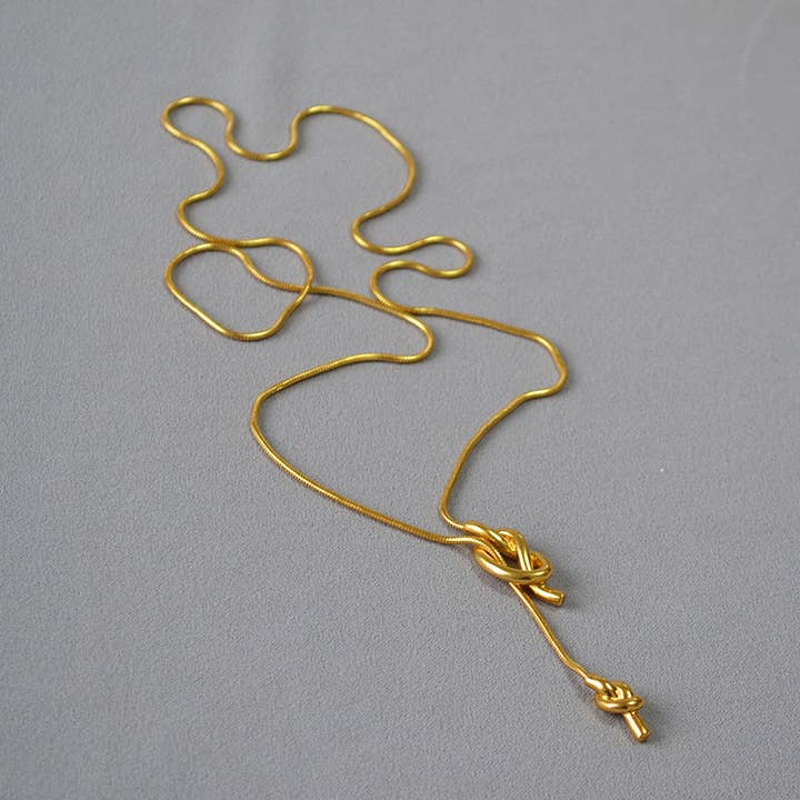 Revelari - Wholesale Pendant/Charm Necklace - Gold Knot Pendant Necklace1