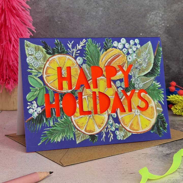 Happy Holidays Oranges Neon Christmas Card for wholesale by Miss Bespoke Papercuts