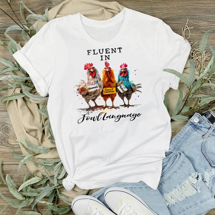 Camiseta divertida con diseño de pollos que hablan con fluidez en el idioma de las aves para venta al por mayor de Avery Lane Gifts