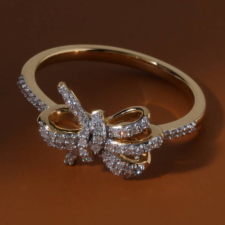 1/6ct TDW Diamond Knot Bow Fashion Ring in 10K Gold for wholesale by De Couer New York