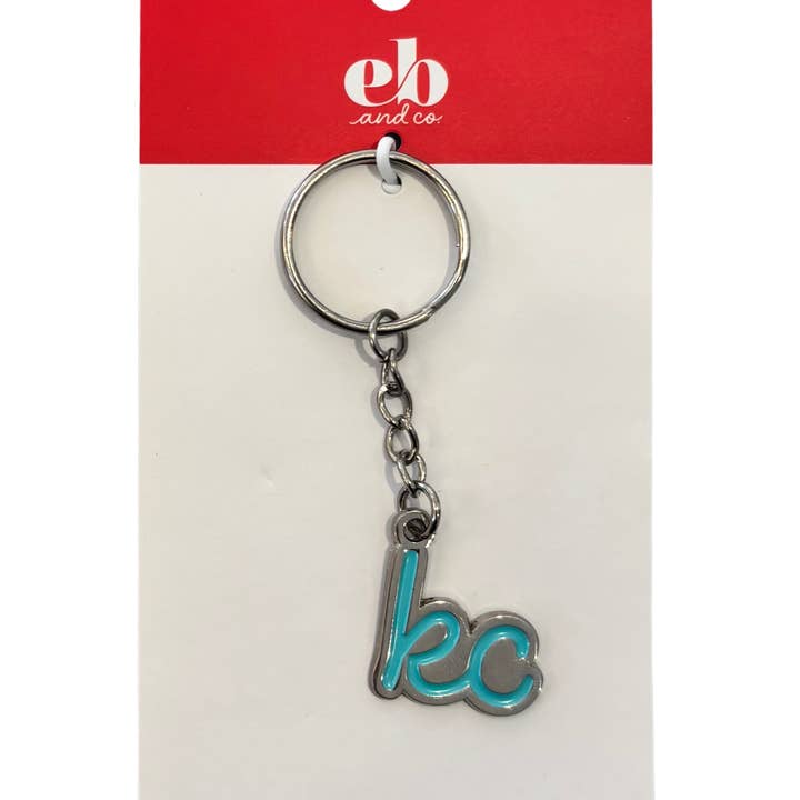 Porte-clés avec inscription en argent et bleu sarcelle de Kansas City pour la vente par EB and Co.