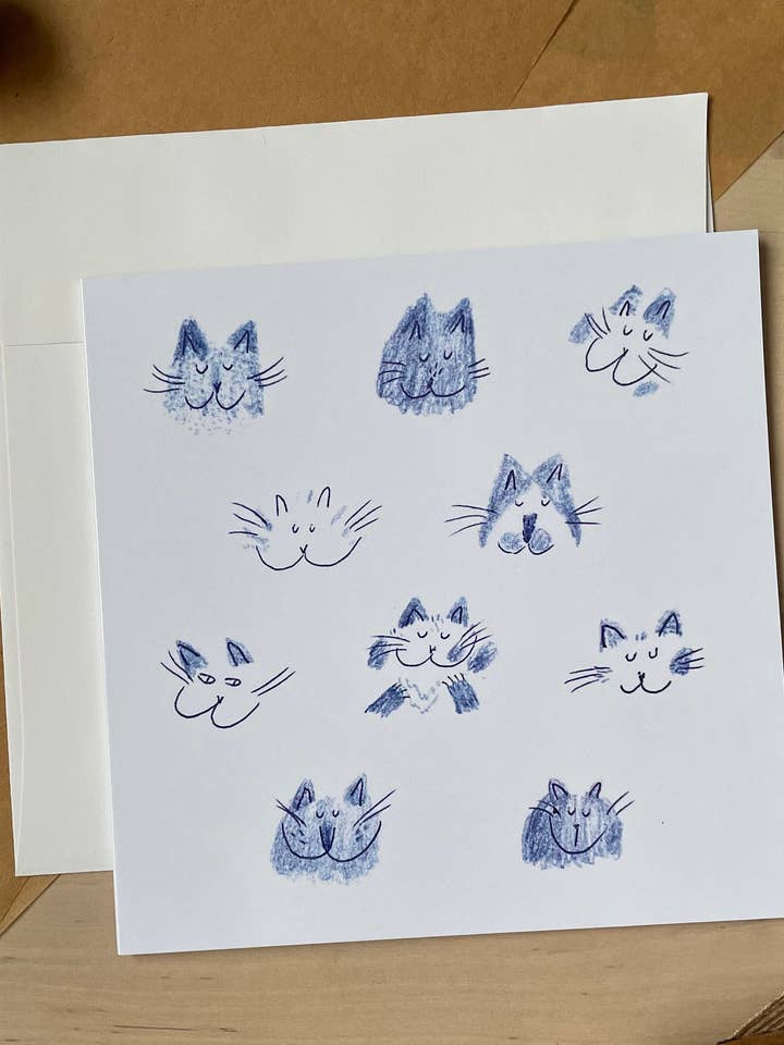Blue cat heads: Greeting card for wholesale by Dariia Dziuba
