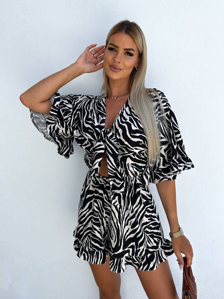Lily Clothing - Wholesale Romper - Women's - Zebra-print rotator cuff V-neck lace-up rompers