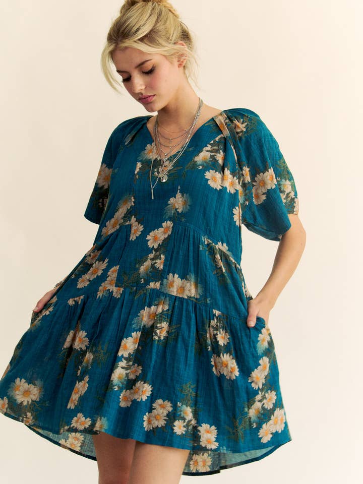 Teal Blue FLORAL PRINT SHORT BELL SLEEVE PLEATED MINI DRESS for wholesale on Faire