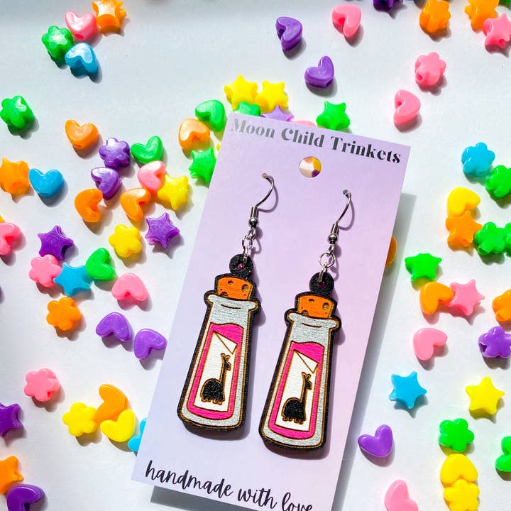 The Emperor's New Groove Yzma's Extract of Llama Earrings for wholesale by Moon Child Trinkets