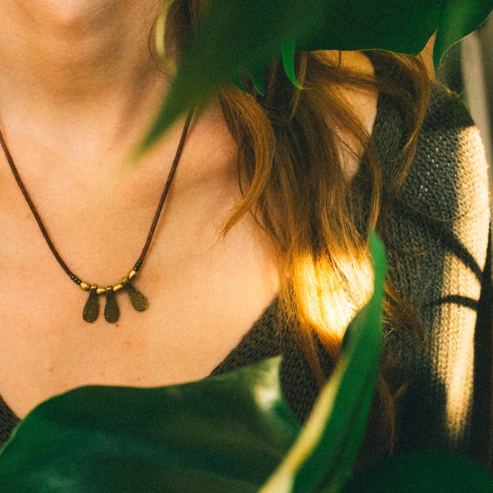 Leather minimalist necklace with 3 brass flat drop charms for wholesale by Nomadu