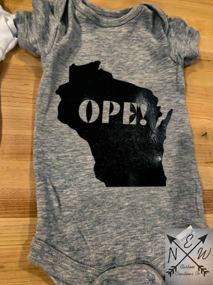 WI Ope! Novelty 100% Cotton Baby Bodysuit/Wisconsin for wholesale by N.E.W. Custom Creations Co LLC