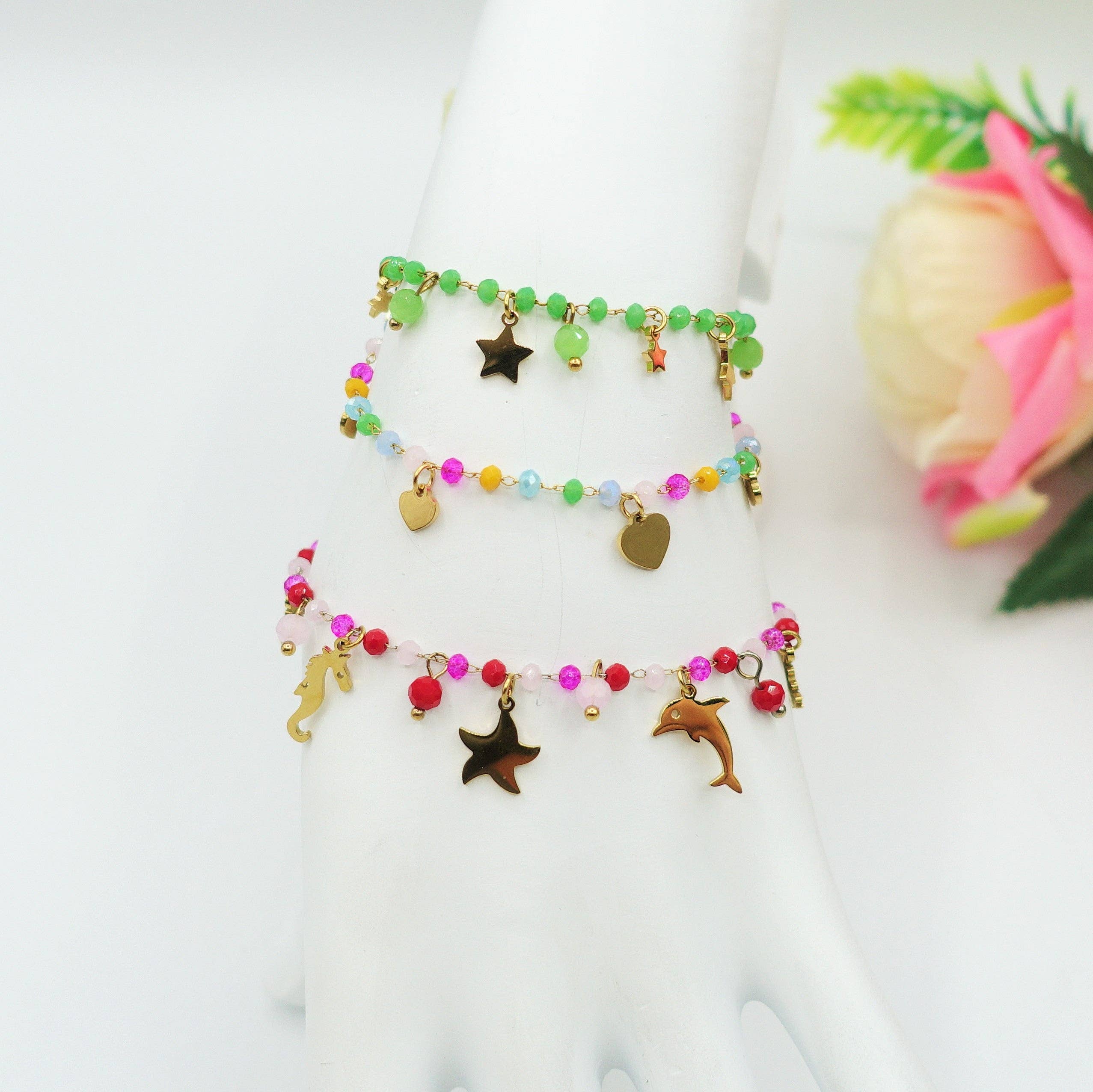 FUXIA MILOS~ ARMBAND I ROSTFRITT STÅL med pärlor och berlocker för wholesale på Faire2