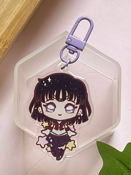 Porta-chaves de Purpurina de Dupla Face da Guardiã Bonita de Saturno por atacado de Peony Lee Art