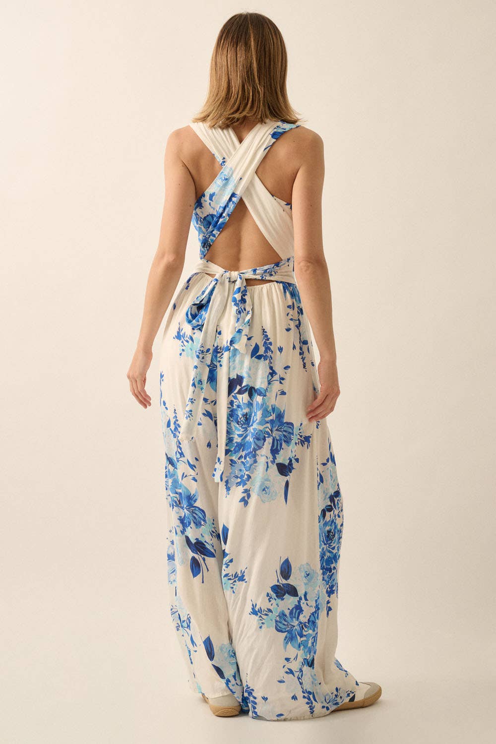 Off White Blue Plunging Neck Floral Woven Jumpsuit for wholesale on Faire8