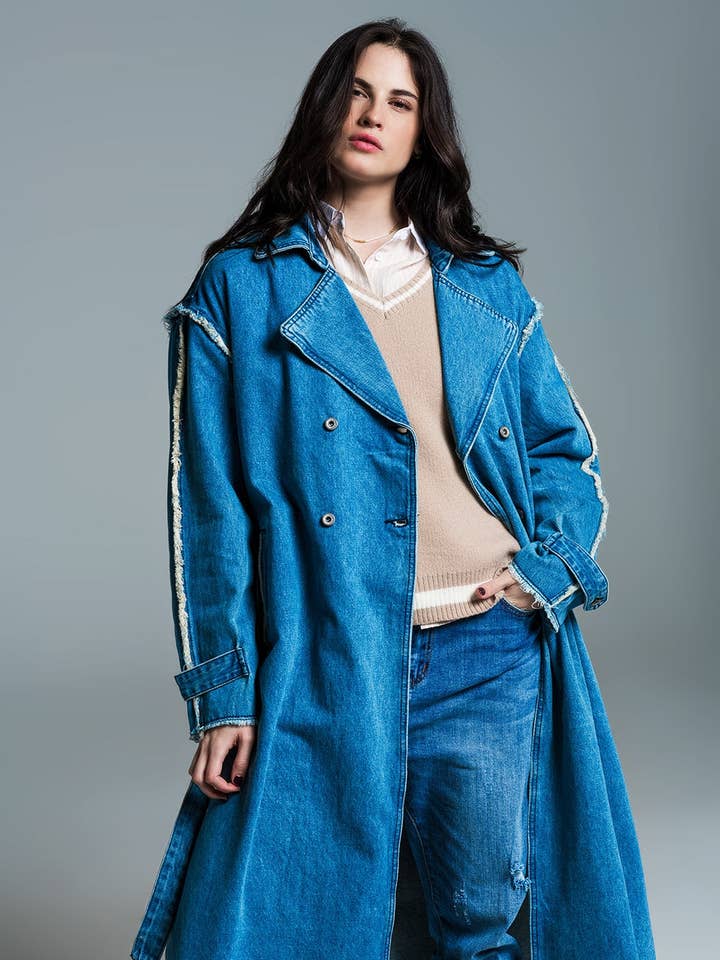 Demin trench coat with belt and raw edges in mid wash for wholesale by Q2—All Orders:Free Duties for the US,UK,and Canada