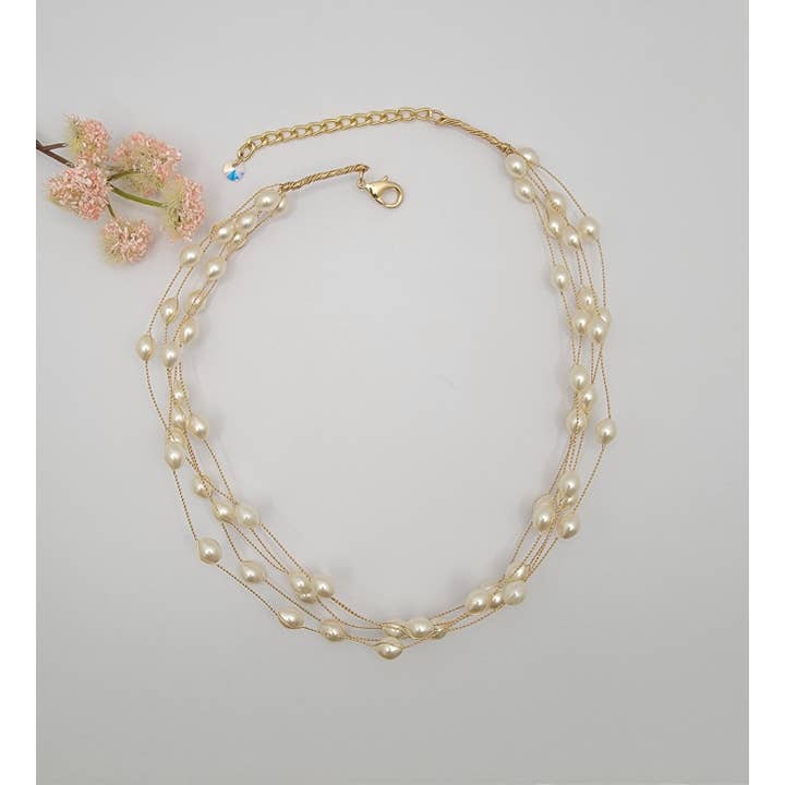 MULTI STRAND FAUX PEARL NECKLACE. for wholesale by BETTYOH INC