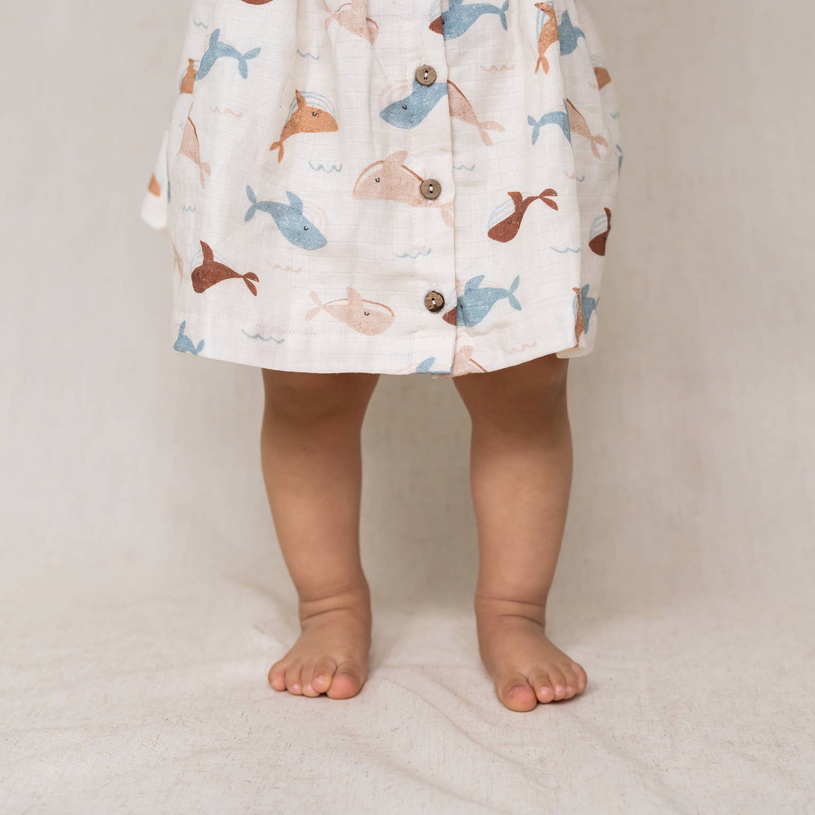 Natural Whales Ruffle & Button Baby Dress+Bloomer (Organic Muslin) for wholesale on Faire3