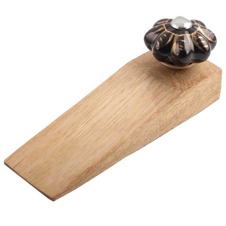 100 Piece Wood Leaf Melon Outdoor Door Stopper (Black) for wholesale by Daana Paani LLC