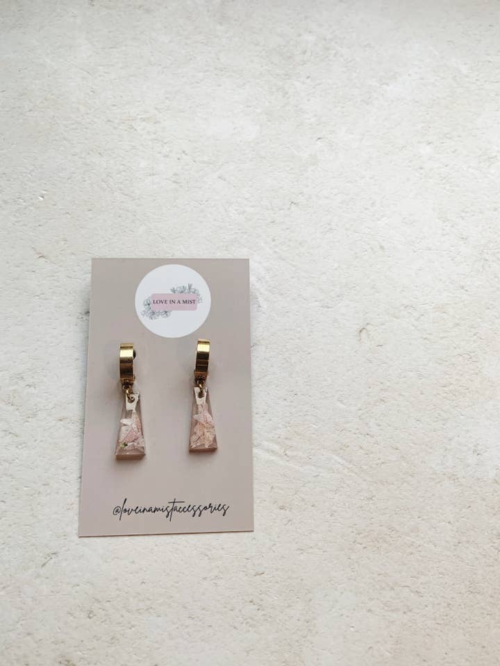 Resin drop gold huggie hoop earrings, real flower earrings for wholesale by Love in a mist