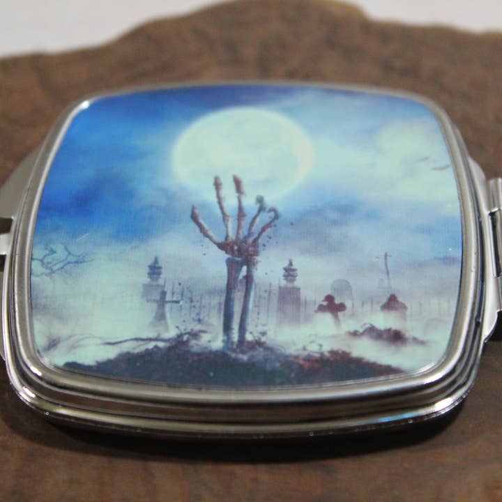 Skeleton Hand climbing from grave // 2.5in Compact Mirror for wholesale by Raven Design