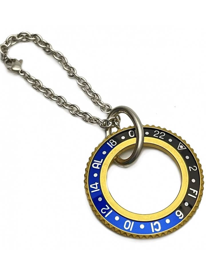 LLAVERO VELOCÍMETRO OFICIAL PVD ORO COLOR NEGRO/AZUL para venta al por mayor de Speedometer Official